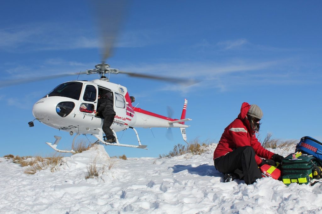 Adventure sport travel insurance FAQ Interview Snowcard Insurance MD Pixabay royalty free image of rescue helicopter