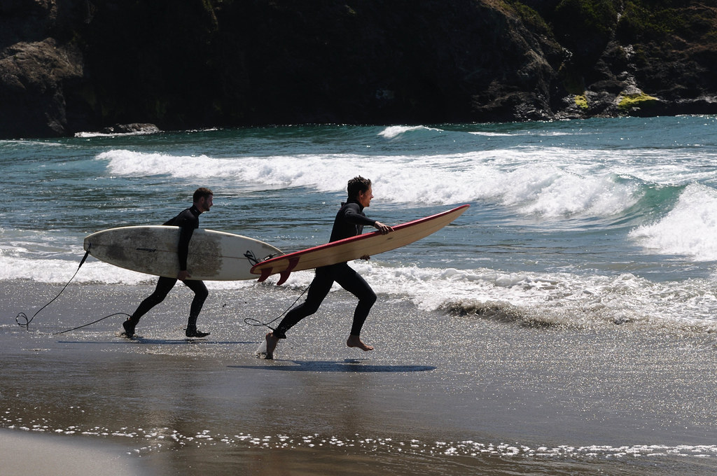 Seattle to San Diego surfing road trip Best west coast surf spots in US Flickr CC image of surfers at Mendocino by Hitchster