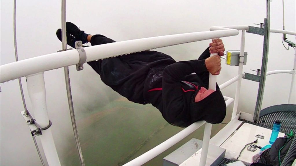 Extreme street workouts and rooftopping Dragon flag 250 meters image copyright of Petr Hulk