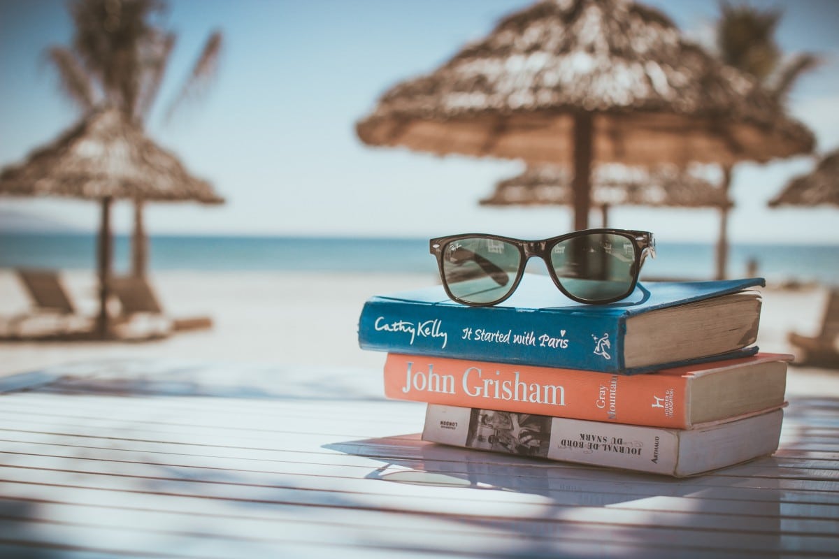 reading books while travelling sunglasses and beach pxhere royalty free image