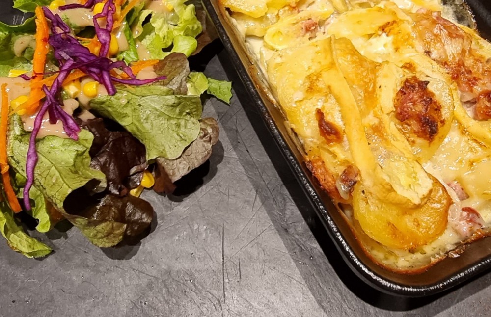 Tartiflette duing December review of Les Menuires snowboard holiday in the French Alps