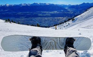 Review of Borealis Artefact freeride snowboard at Nordkette looking down at Innsbruck in Austria